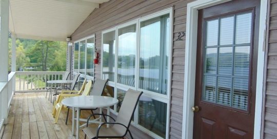 Beach suite porch with chairs and tables