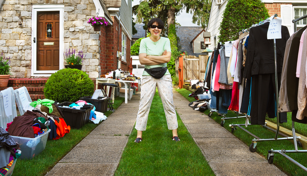 Picture of woman enjoying world's largest garage sale.